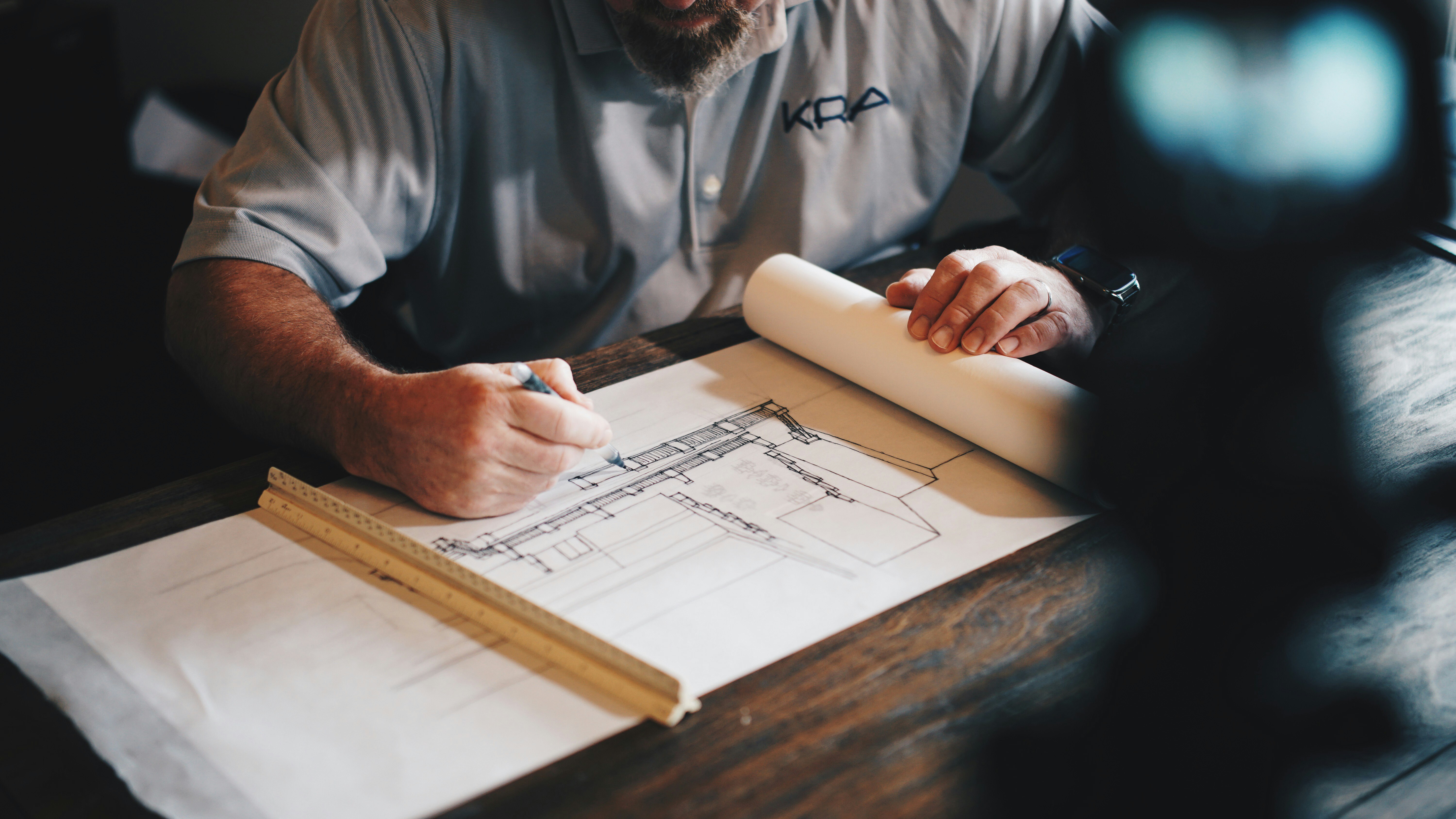 Urban planners reviewing blueprint and land use plan